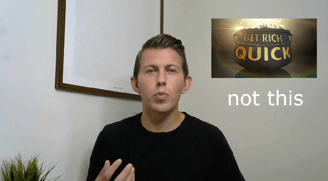 Video still: Paul talking to the camera beside a Get Rich Quick pot of gold labeled not this