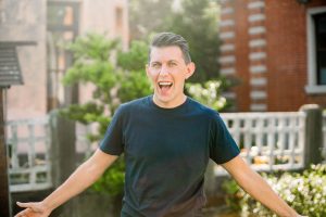 Paul standing with open arms